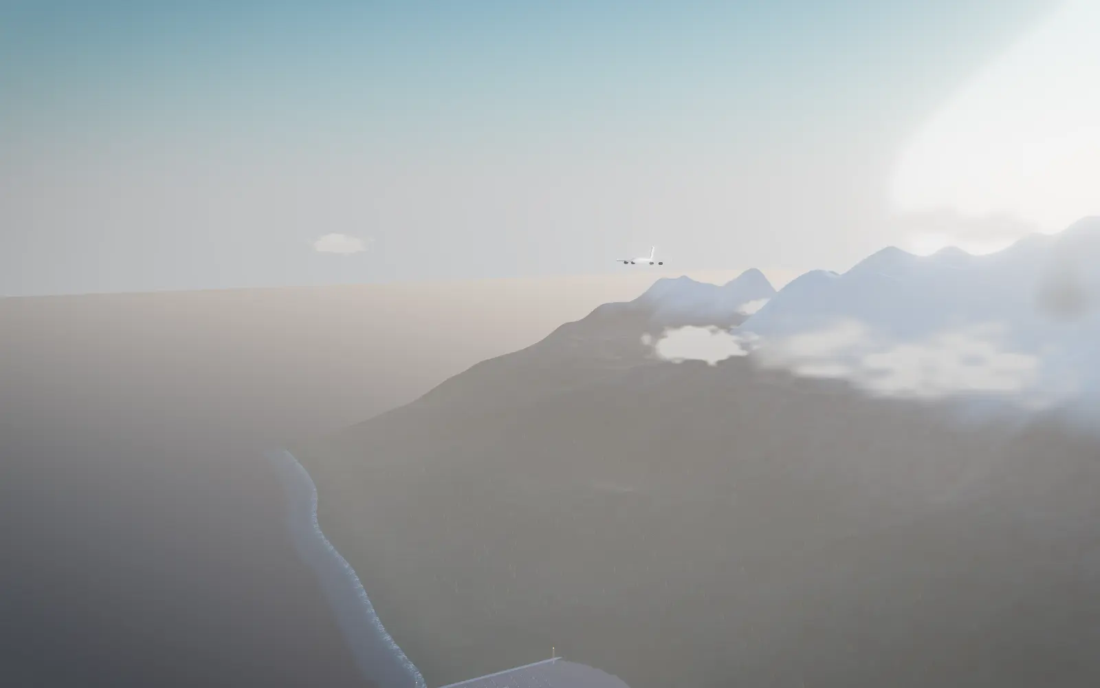 A cargo aircraft crossing a cold dawn sky above the British Columbia coast