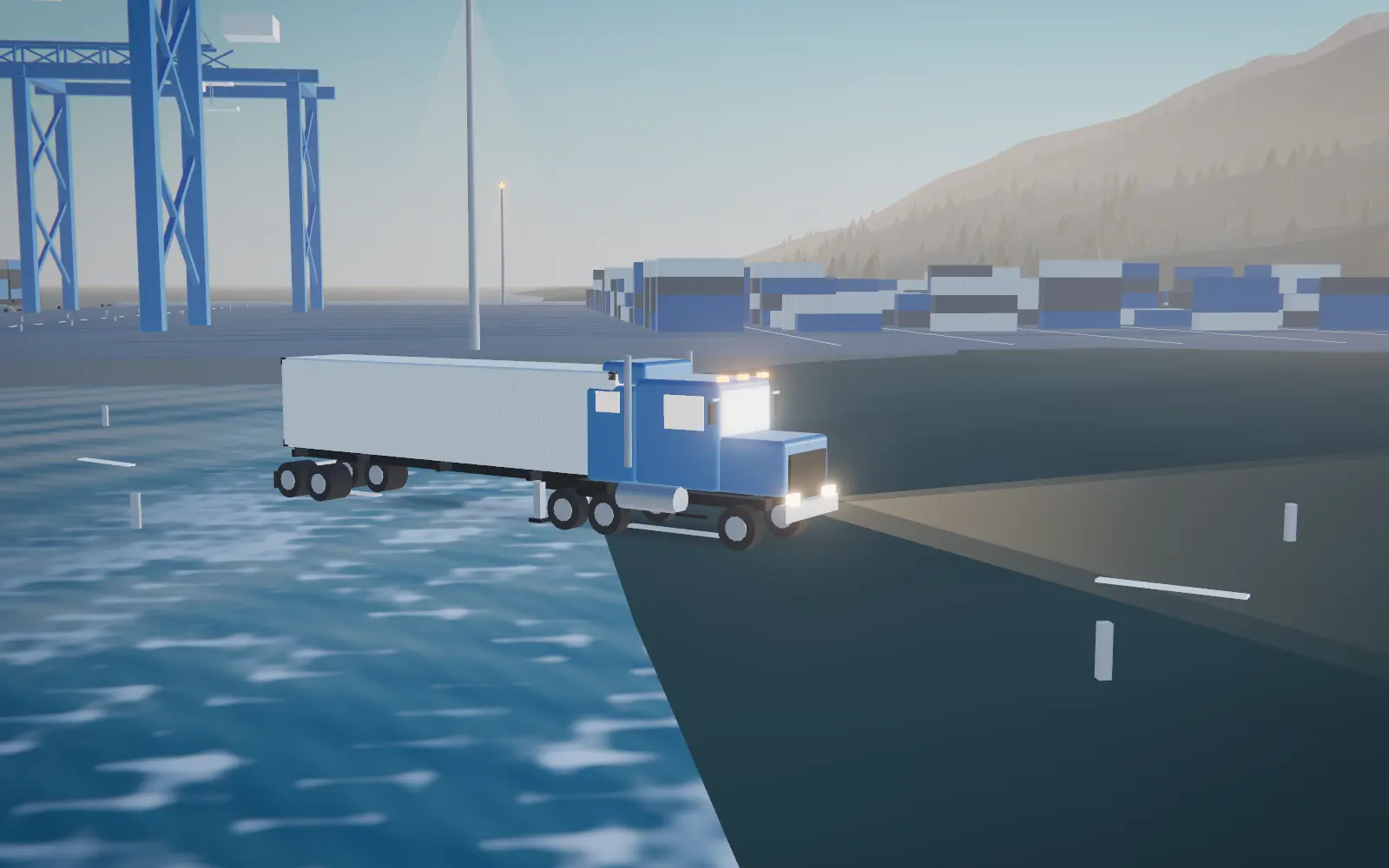 A Kattz tractor pulling a container along a coastal highway at dawn